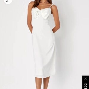 Pretty ivory spaghetti strap midi dress with large bow
